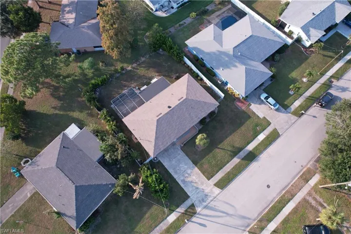 Aerial overview of property's location with nearby suburban area