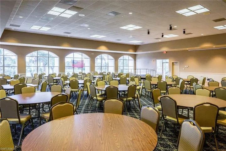 Dining room featuring carpet flooring and a drop ceiling