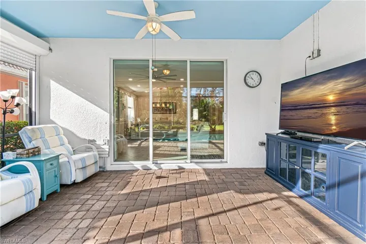 SPACIOUS & BEAUTIFULLY PAVERED LANAI WITH 3 GLASS SLIDING DOORS.