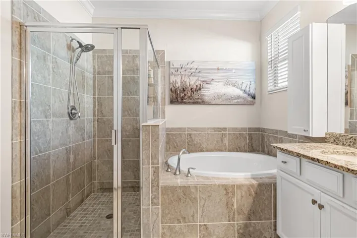 CLOSE-UP VIEW OF THE BEAUTIFULLY TILED WALK-IN SHOWER!