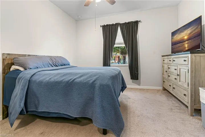 SPACIOUS GUEST BEDROOM WITH ADDED "CLOSET BY DESIGN" CLOSET.