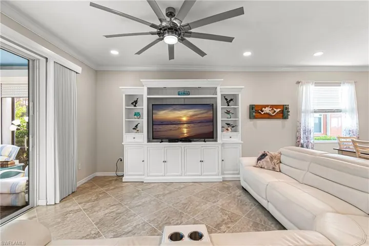 PRIVACY BLINDS, TILE ON THE DIAGONAL & CROWN MOLDING MAKE THIS LIVING ROOM SPECTACULAR & READY TO ENTERTAIN FAMILY & FRIENDS!