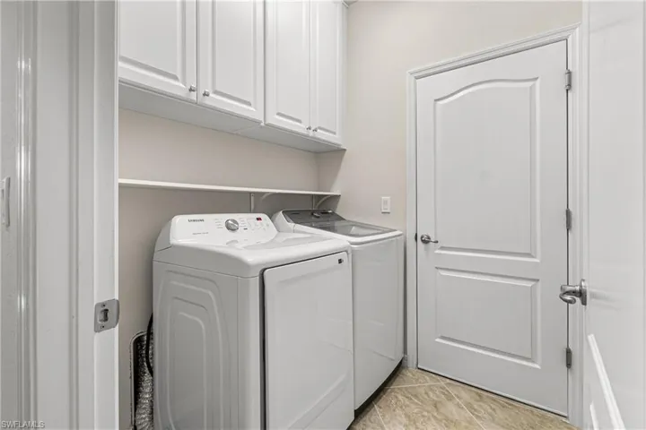 THE LAUNDRY ROOM HAS 42' WHITE CABINETS & THE NEW SAMSUNG DRYER IS LESS THAN 3 MONTHS OLD!