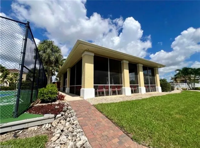 Back of house with a sunroom