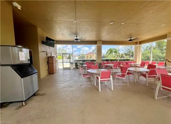 Sunroom featuring finished concrete flooring