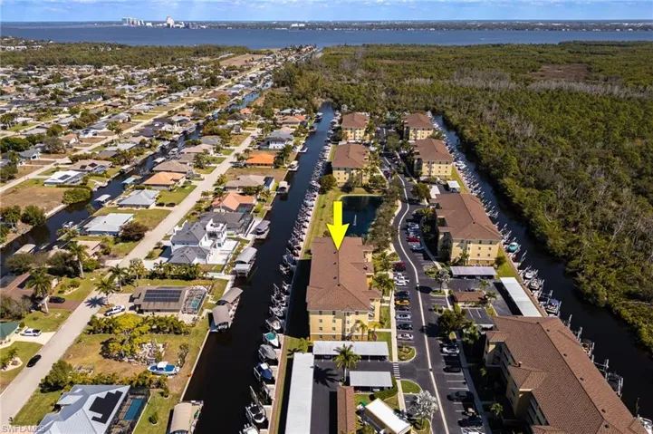 View of property location with a nearby body of water and nearby suburban area
