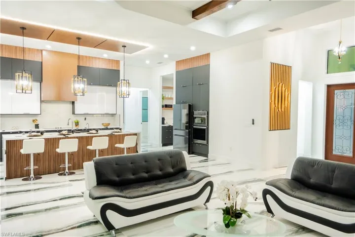 Tiled living room with beamed ceiling