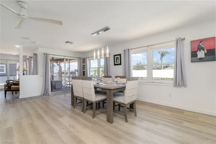 Dining space featuring light wood finished floors and a ceiling fan