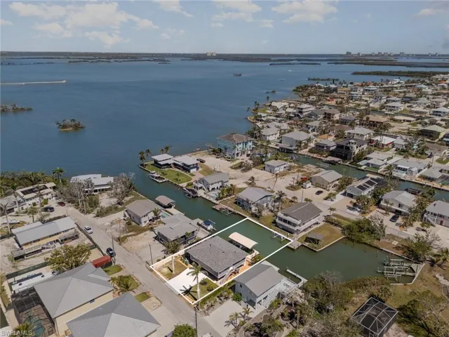 Aerial view of residential area with a large body of water