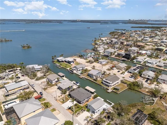 Aerial view of residential area with a large body of water