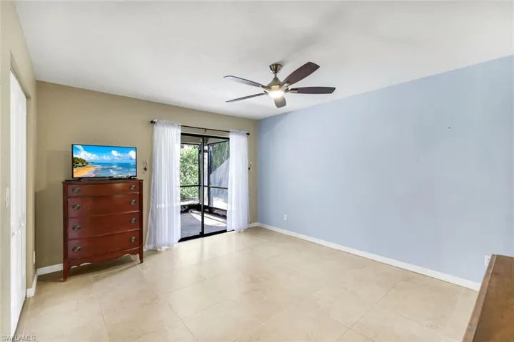 Spacious Primary bedroom retreat opening out to a large private screened lanai.