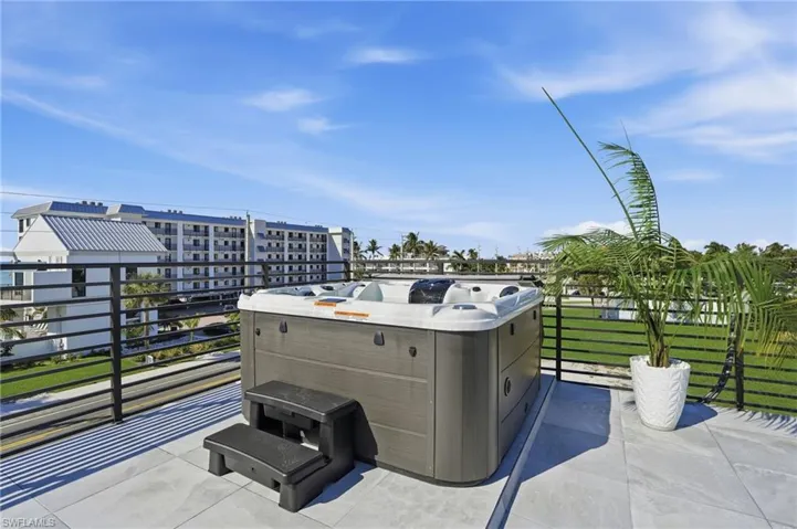 View of patio / terrace with a hot tub