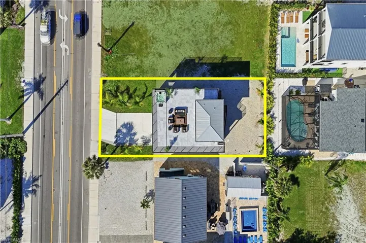 Aerial overview of property's location with property parcel outlined and a pool area