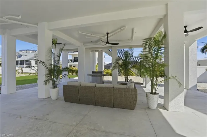 View of patio with a ceiling fan  area -