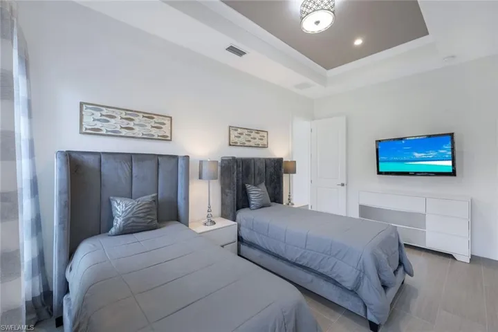 Bedroom with a tray ceiling