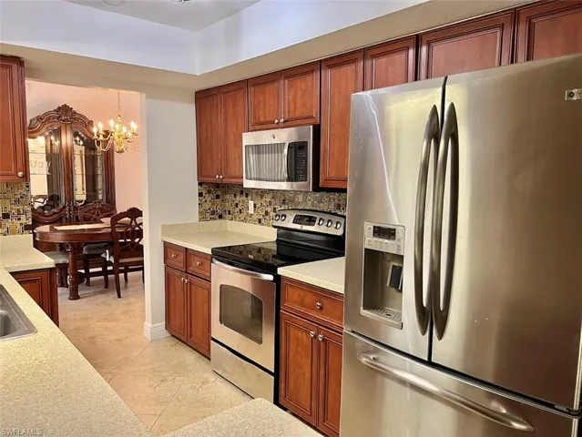 Kitchen with SS appliances and corian counter tops