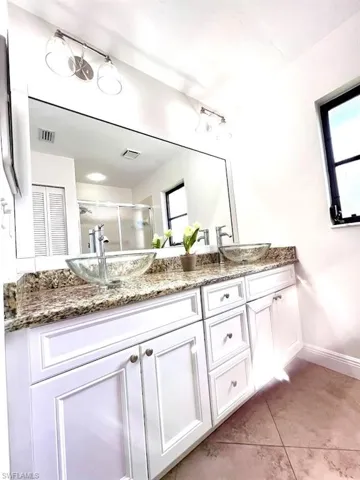 Master Bathroom with double glass bowl sinks