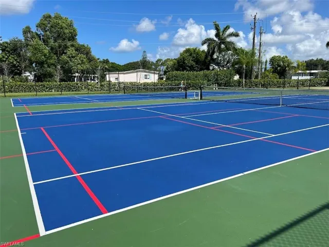 View of tennis court with basketball court
