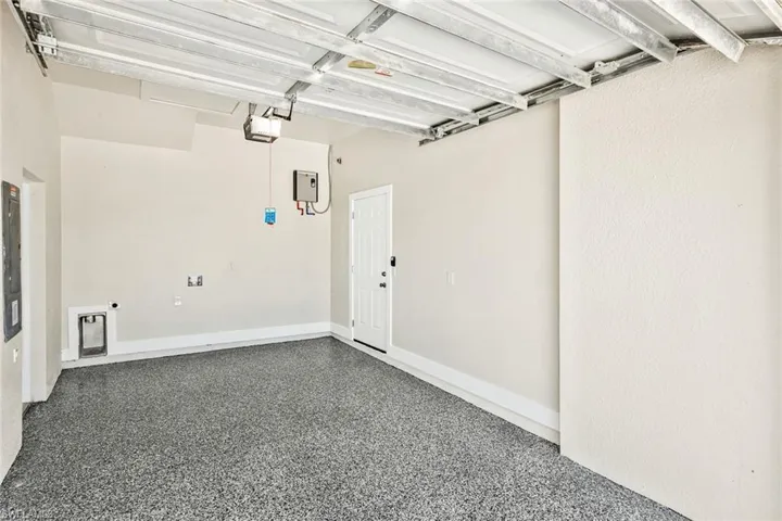 Garage featuring electric panel