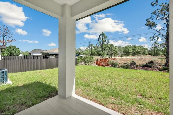 Fenced backyard with a patio area