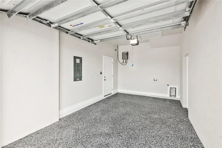 Garage featuring electric panel