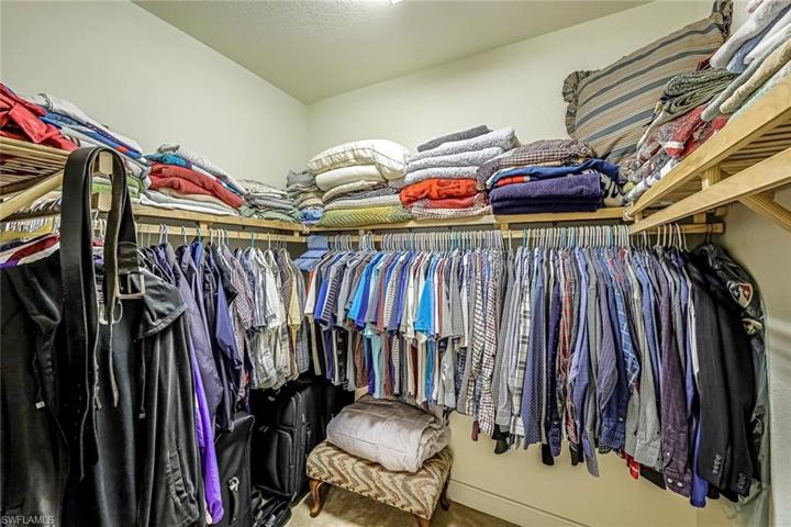 Primary bedroom walk in closet