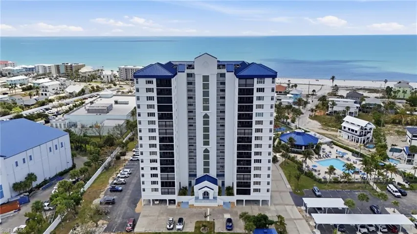 Ocean Harbor Condominium and a nearby body of water - Virtually Edited Image