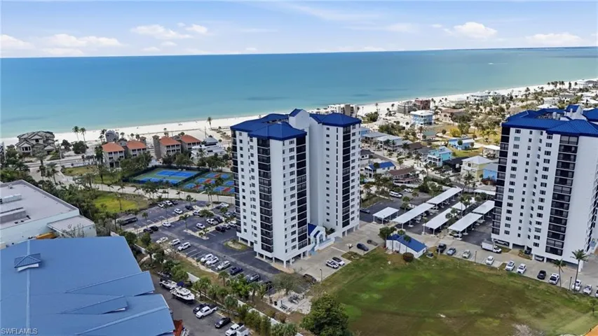 Drone / aerial view of expansive beach and apartment complex - Virtually Edited Image