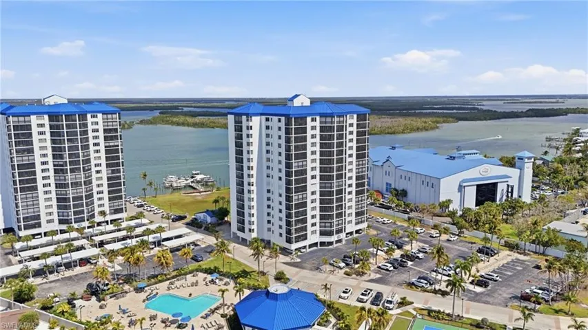 Drone / aerial view of a large body of water and apartment complex - Virtually Edited Image
