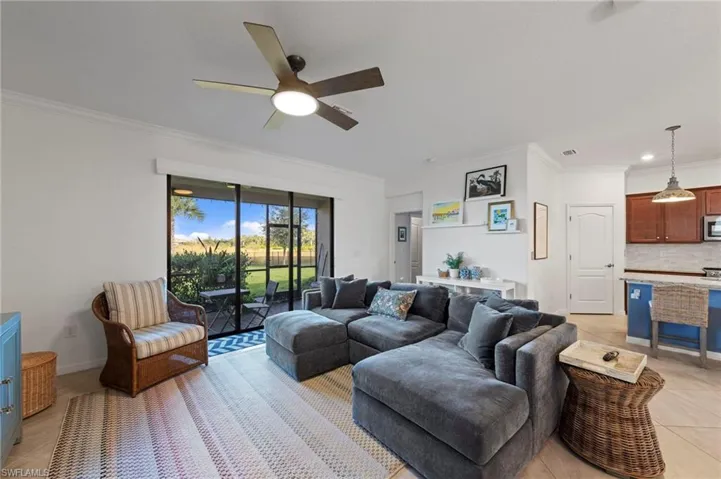 Crown molding, motorized privacy shades with slider access to screened lanai.