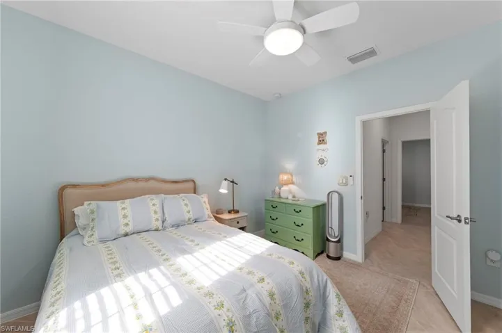 Recessed ceiling with a flush-mount ceiling fan, light blue wall finish, and tile flooring