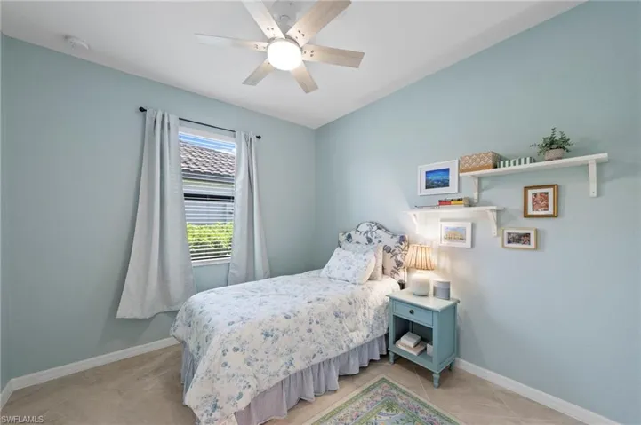 Ceiling fan with integrated lighting, window with blinds