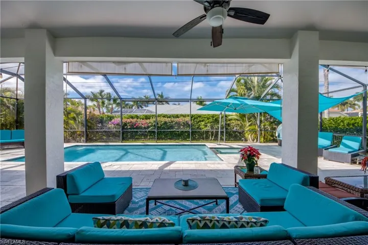 Outdoor pool featuring an outdoor hangout area, a patio area, and a sunroom