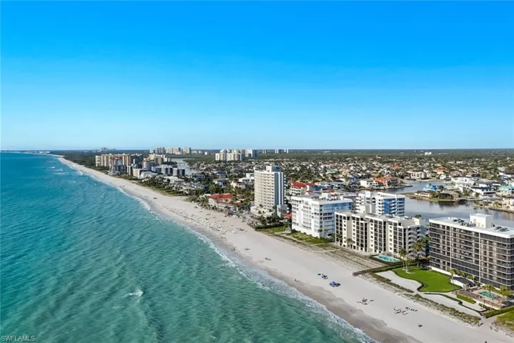 View of urban area featuring expansive beach