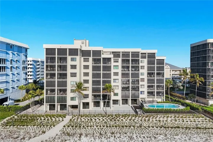 View of apartment building / complex featuring a swimming pool