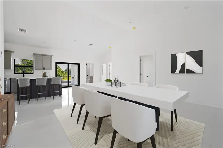 Dining room with lofted ceiling