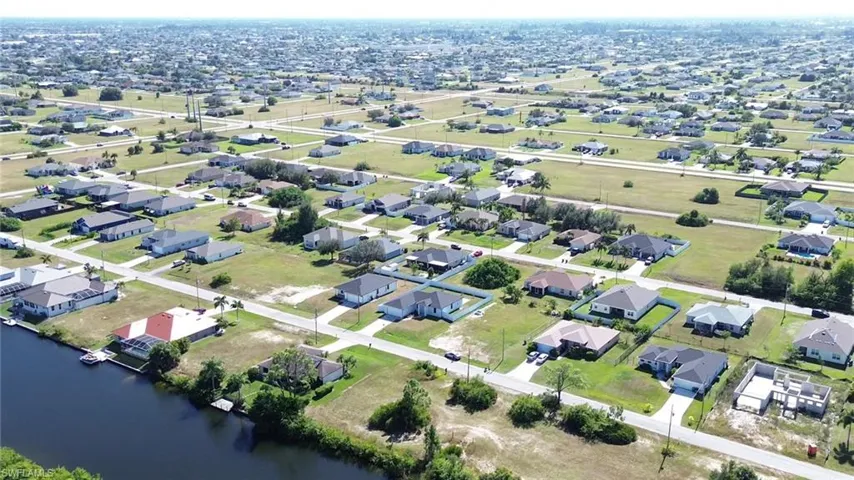 Aerial overview of property's location featuring nearby suburban area