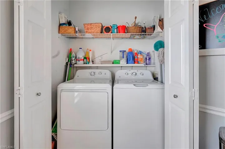 Laundry closet located beside kitchen area
