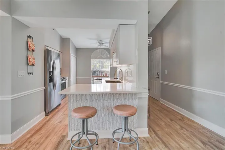 Entry way and kitchen area with island