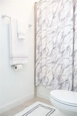 1st Floor Full bathroom with shower / bath combination with curtain