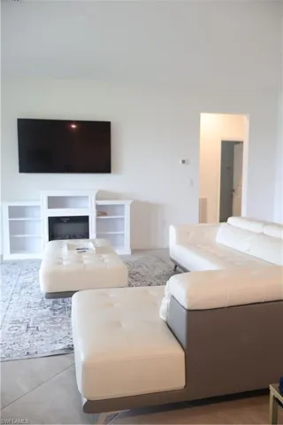 Living room featuring light tile patterned floors