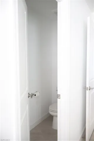 Master Bathroom: toilet area with privacy door
