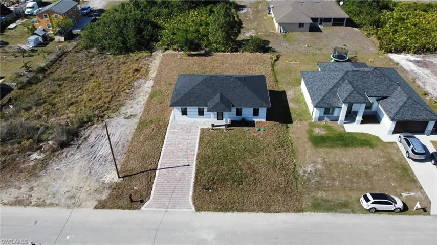Birds eye view of property with a residential view