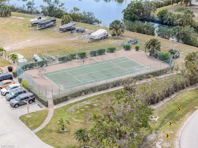 Birds eye view of property with a water view