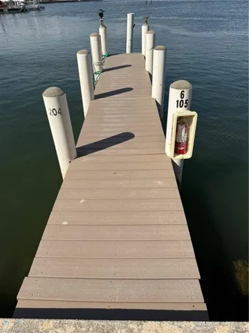 Waterfront dock with composite decking and multiple pilings