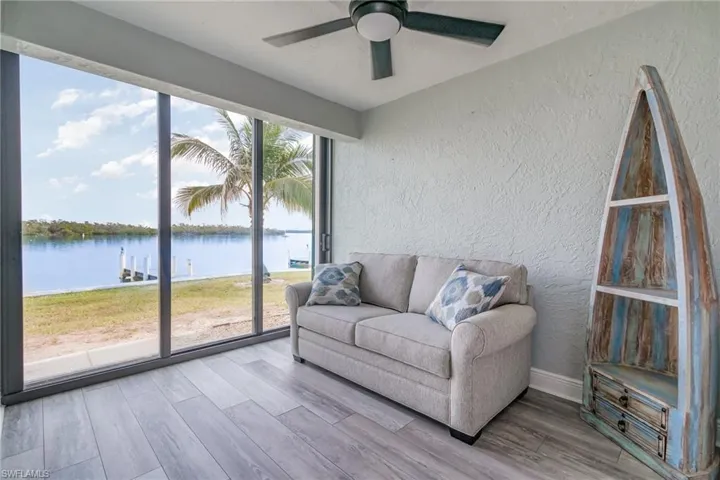 Sunroom with a water view