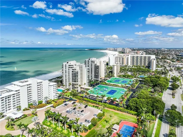 Aerial view featuring a water view and a city view