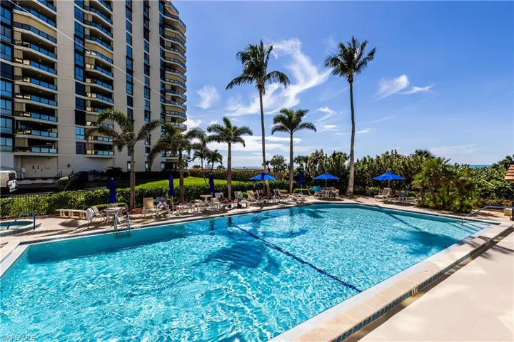 Community pool with a patio