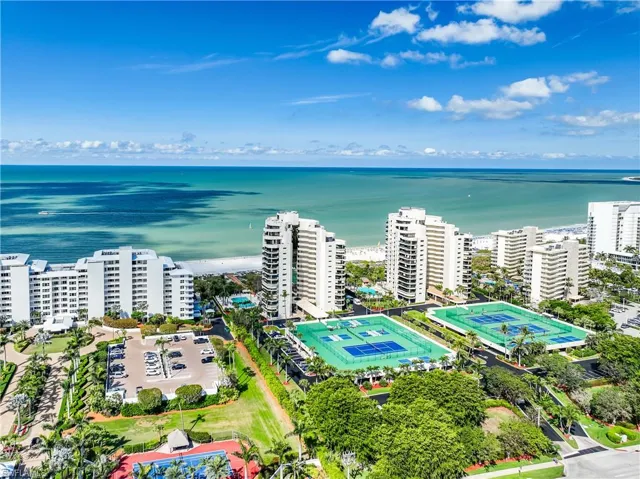 Birds eye view of property with a water view and a city view