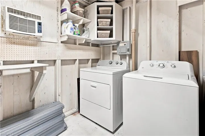 Corner shelving unit, wall-mounted shelving, pegboard storage, and window-mounted air conditioning unit
